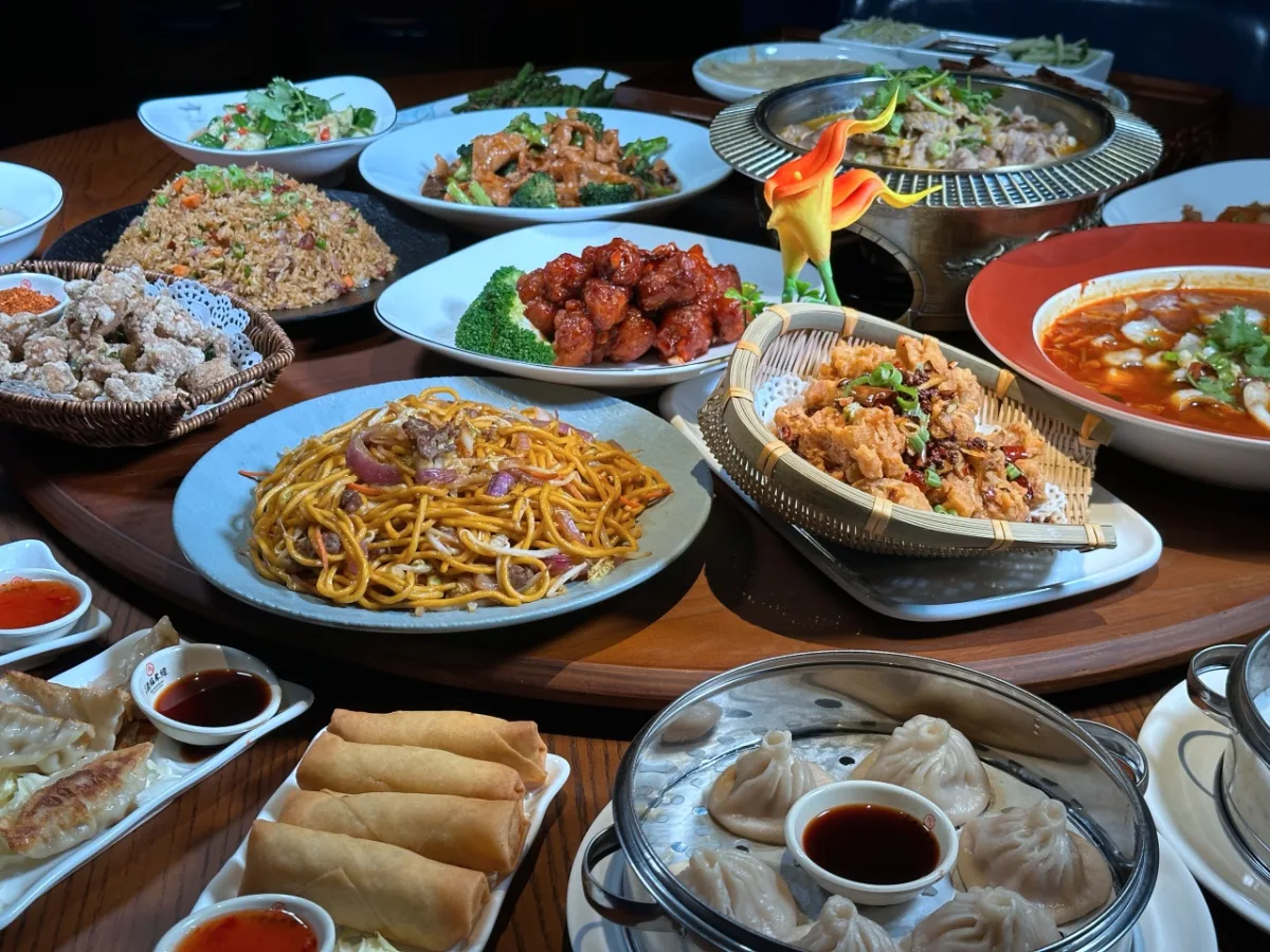 Family-style table spread of JIANG dishes