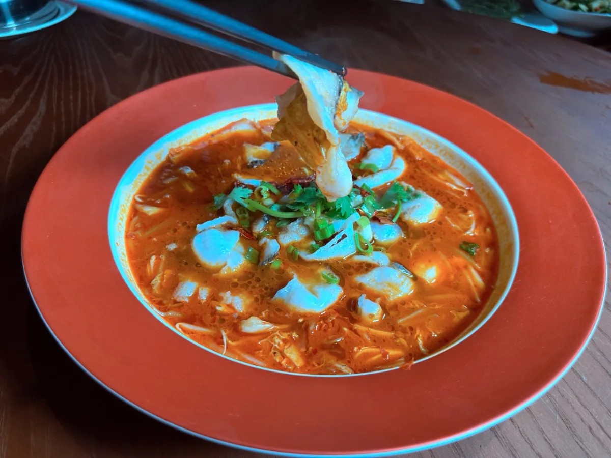 Sizzling spicy boiled fish fillet in chili broth